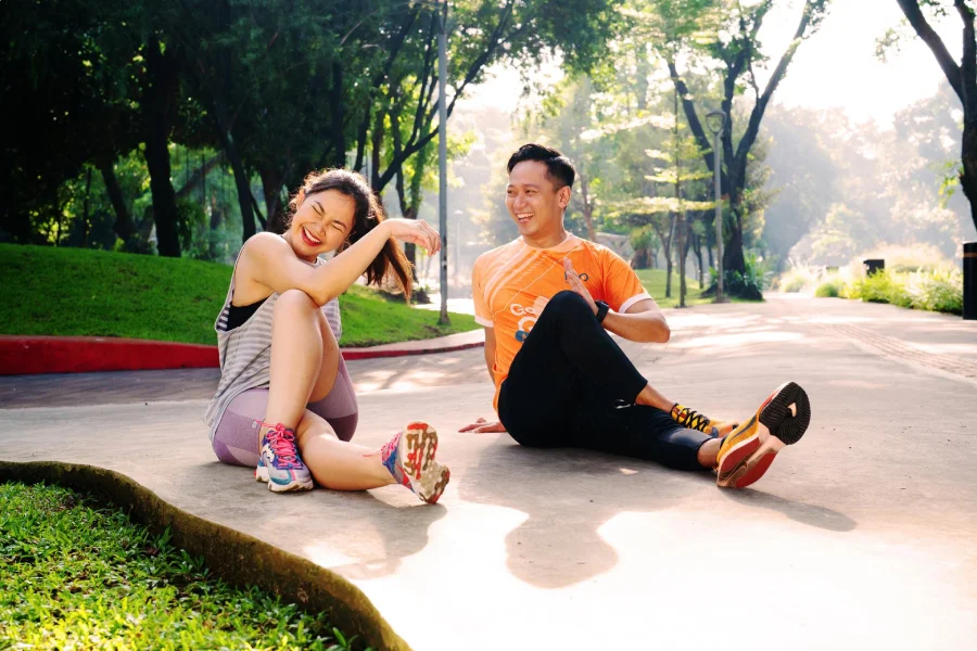 Couple_exercising_in_park_(1).webp