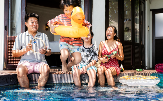 Pinoy family having fun in the swimming pool